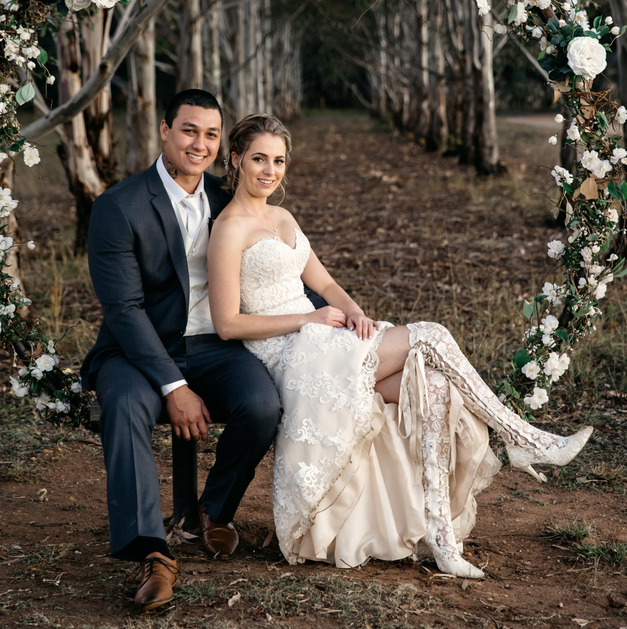 Bride Chloe wearing unique lace over the knee lace wedding boots