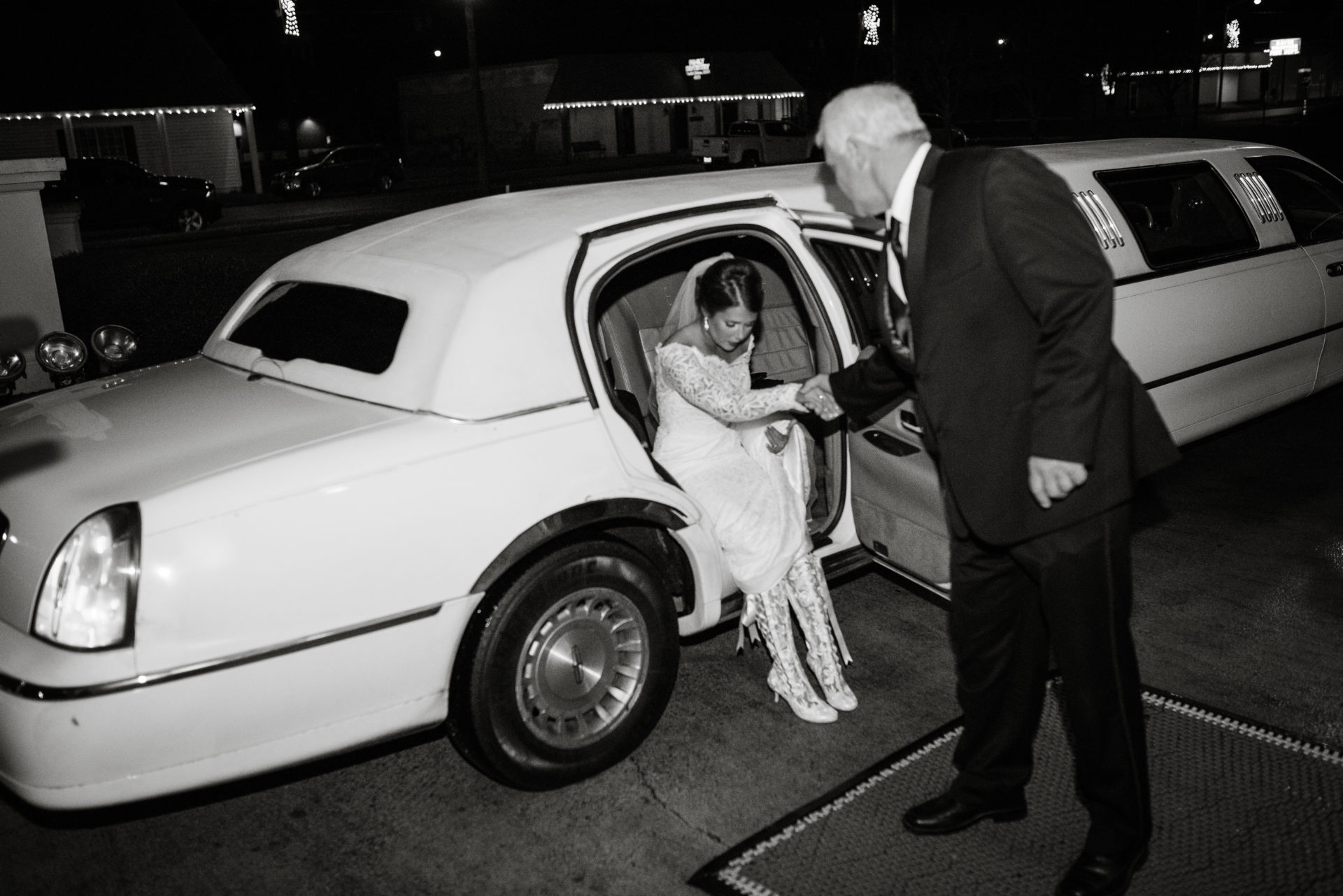 Bride Kali wearing white vintage lace wedding boots