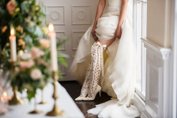Bride wearing Goodnight Sweetheart over the knee ivory wedding boots 