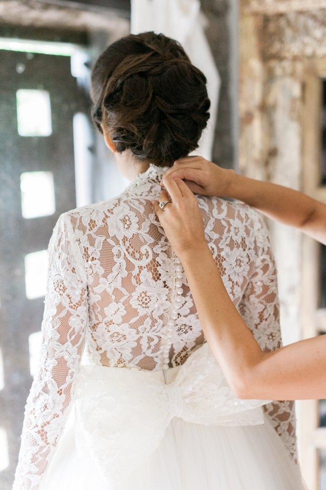 Bride Kathleen wearing a beautiful long sleeved lace wedding dress