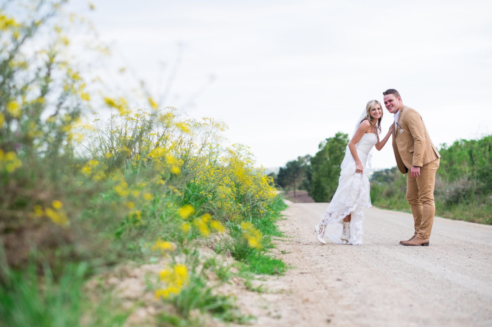 Bride wearing lace wedding boots Lace Cowboy Boots 