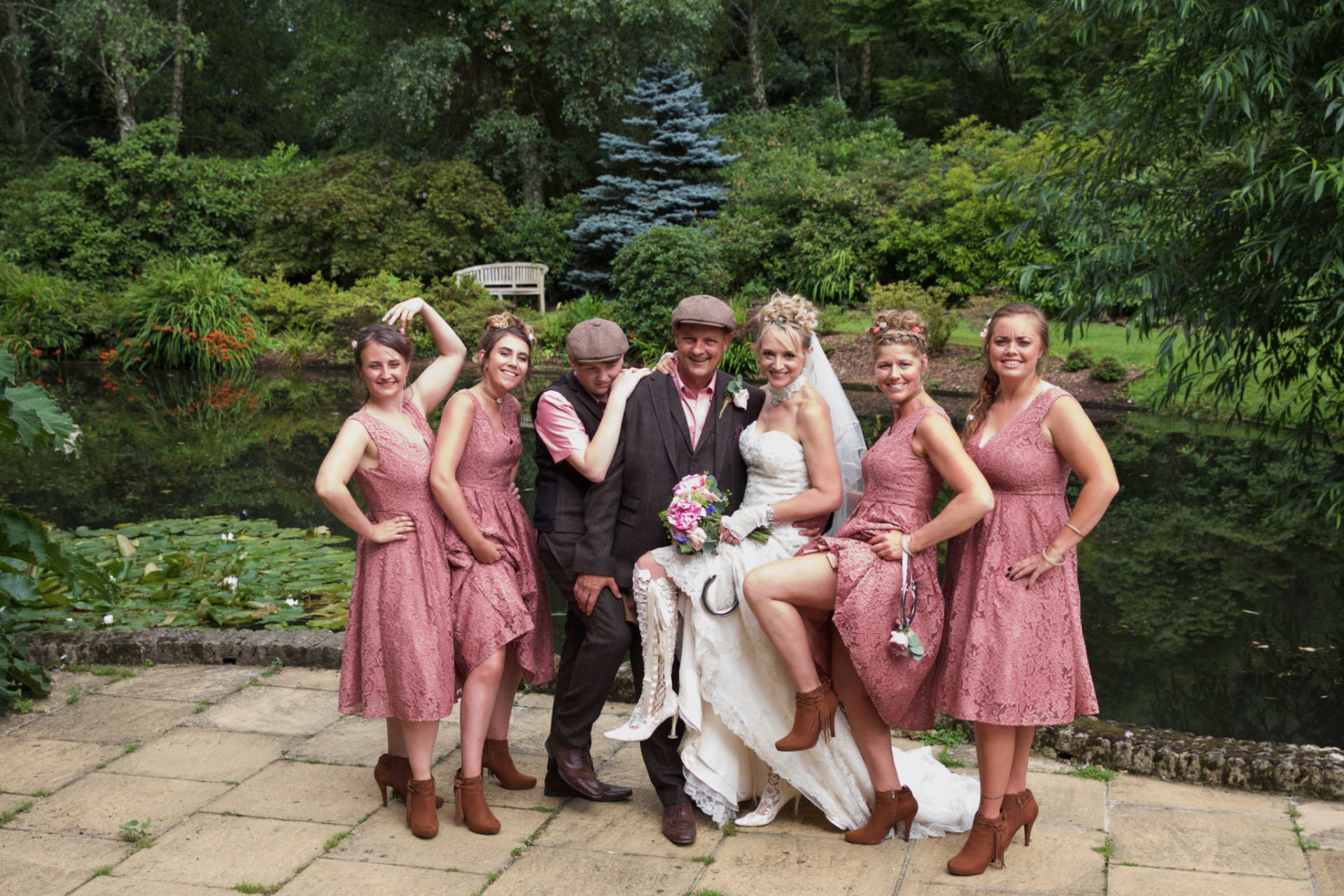 Bride with lace boots and bridesmaids with cowboy boots