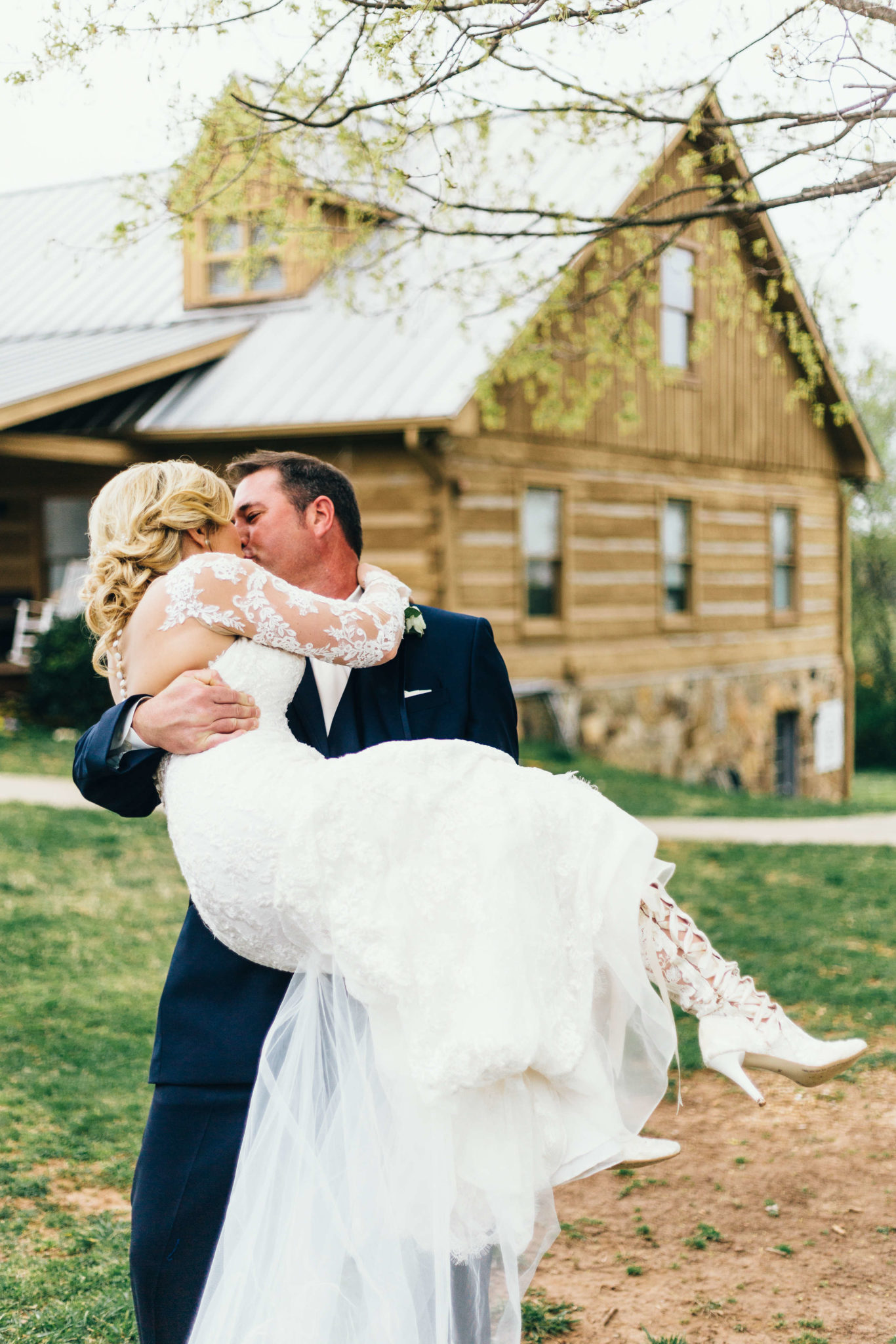 Bride wears House of Elliot lace wedding boots 