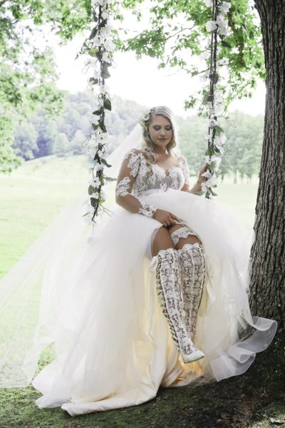 Real Bride Lauren wearing Hailey Page Pippa Gown paired with House of Elliot’ Lace over the knee wedding boots Real Bride Lauren wearing Hailey Page Pippa Gown paired with House of Elliot' Lace over the knee wedding boots