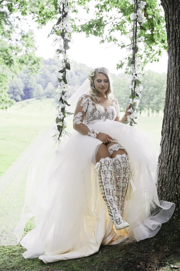 Real Bride Lauren wearing Hailey Page Pippa Gown paired with House of Elliot’ Lace over the knee wedding boots Real Bride Lauren wearing Hailey Page Pippa Gown paired with House of Elliot' Lace over the knee wedding boots