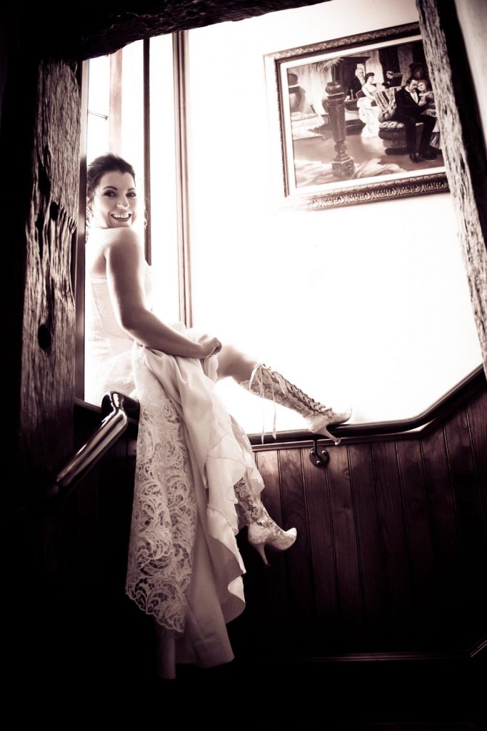 Bride Frances wearing Beatrice Elliot handmade knee high lace boots