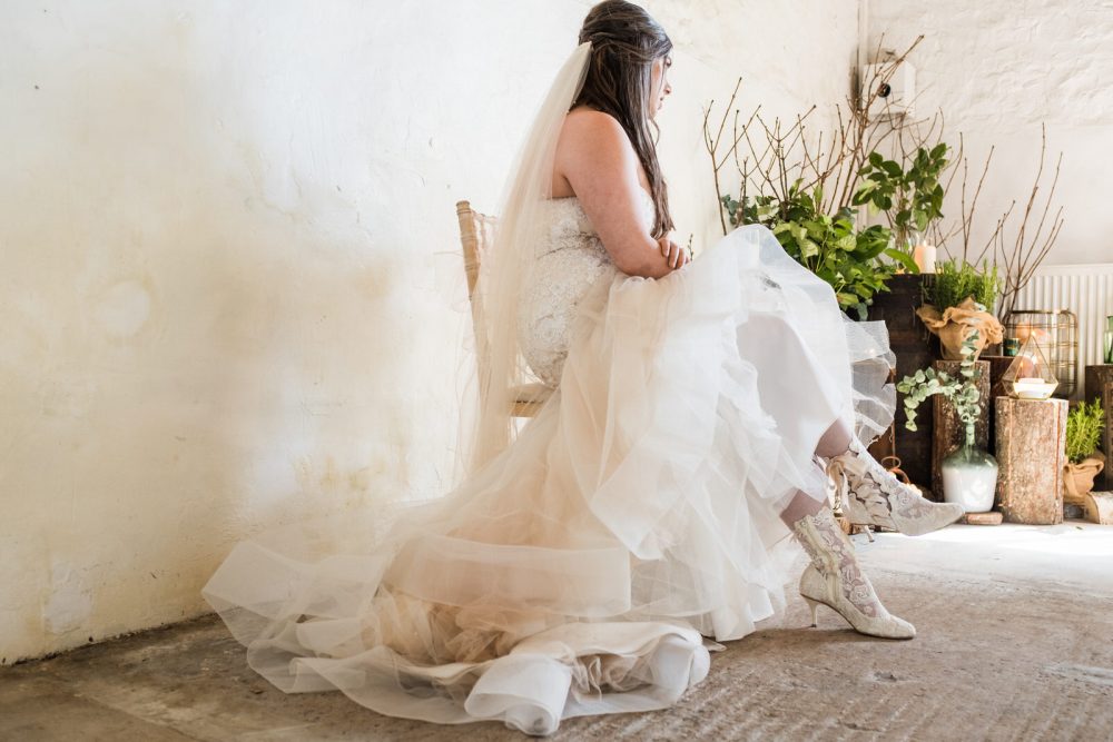 Bride wearing Vintage Lace Wedding Shoes Boots 