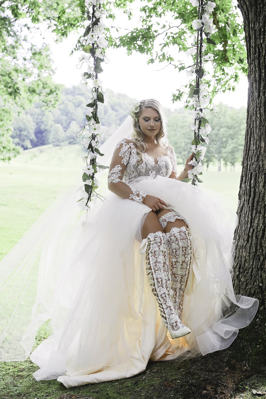 House of Elliot Real Bride Lauren wearing over the knee lace wedding boots