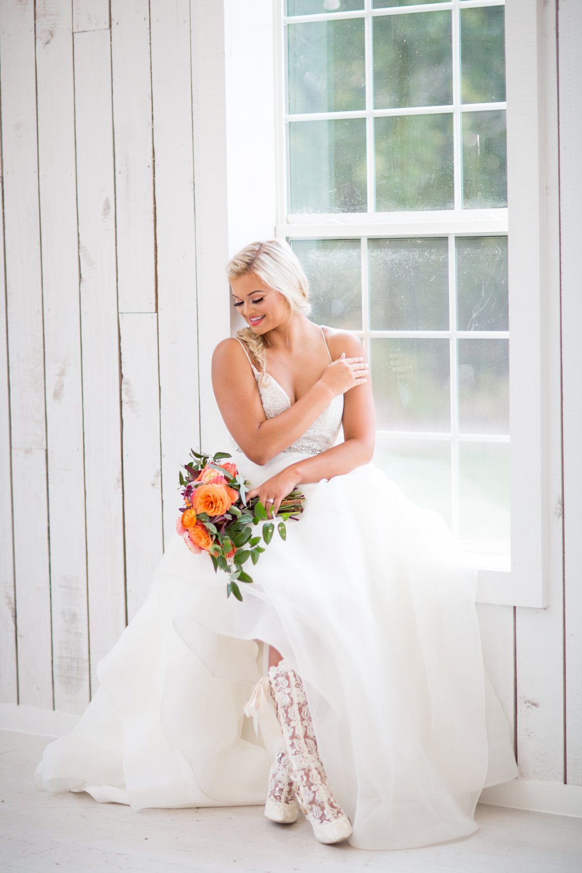 Bride wearing Beatrice Elliot Lace Wedding Boots