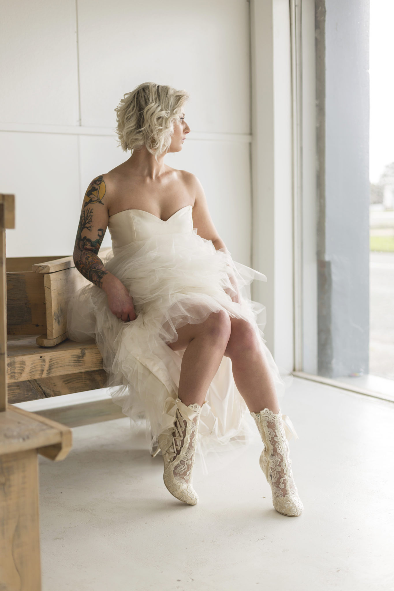 Bride wearing Lottie Elliot Ivory Lace Ankle Boots