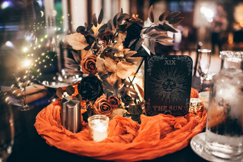 Gothic Halloween wedding table with tarot card centerpiece and candles