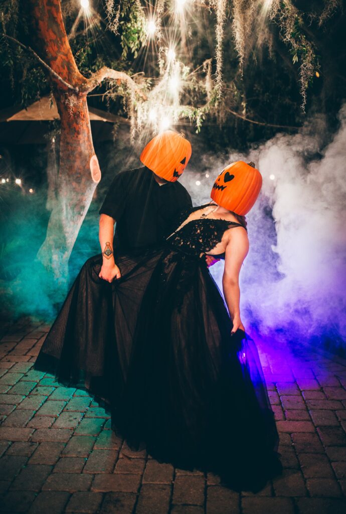 Gothic outdoor wedding ceremony at Historic Dubsdread Ballroom Orlando with hanging vines and lights